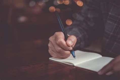 Woman Hand Writing In Small Memo Notebook 2073495 Stock Photo At Vecteezy