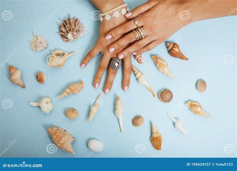 Beautiful Woman Hands With Pink Manicure Holding Sea Shells Lot Of