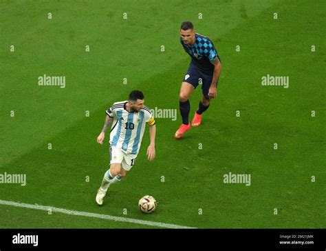 Argentinas Lionel Messi And Croatias Dejan Lovren In Action During