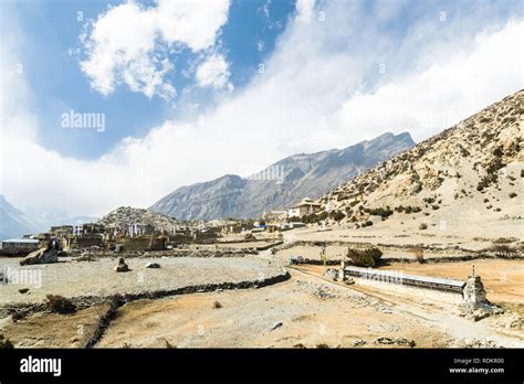 Mani wall and Ngawal village, Annapurna Circuit, Nepal Stock Photo - Alamy