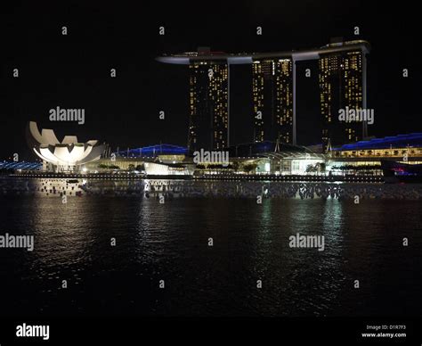 Singapore waterfront night marina bay hotel Stock Photo - Alamy