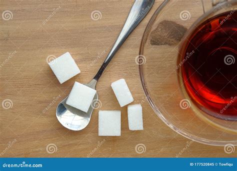 Top View Of Sugar Cube On Spoon On Wooden Background Stock Image