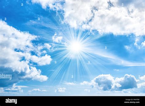 Sun With Sunrays Shining On Blue Sky Stock Photo Alamy