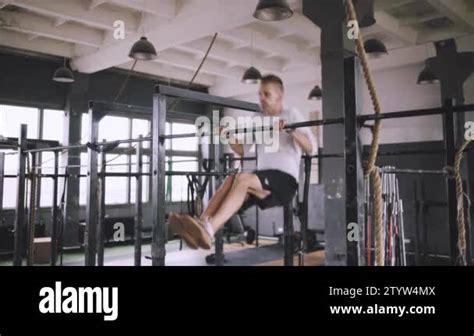 Caucasian Male Athlete With Fit Torso And Strong Hands Doing Chin Ups