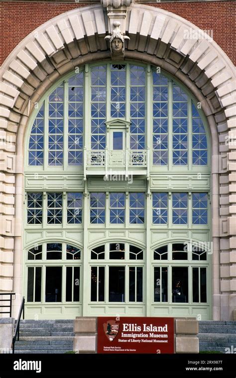 Museum facade with sign, Ellis Island Immigrant Museum, Statue of ...