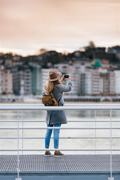 Woman Taking Picture By Stocksy Contributor Javier Pardina Stocksy