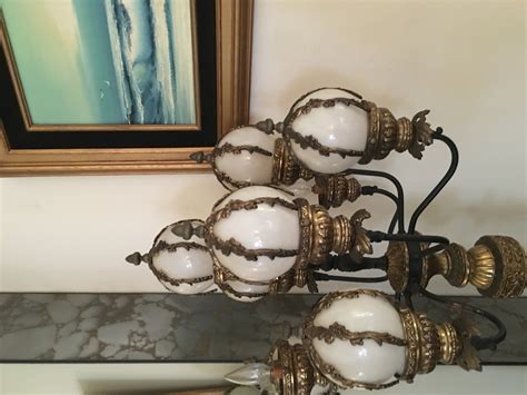 Antique standing globe lamp would like to know how much it's worth ...