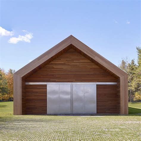 A Large Wooden Building With Two Doors On Each Side