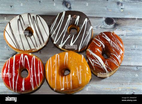 Ring Donuts With Brown And White Chocolate And Caramel Strawberry And