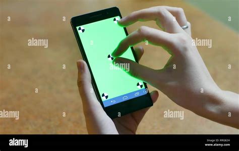 Womans Hands Using A Smart Phone Touchscreen Chroma Key Close Up