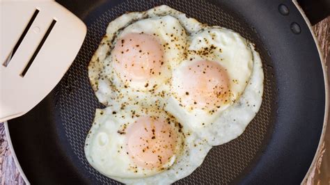 The Real Difference Between Eggs Over Easy And Sunny Side Up