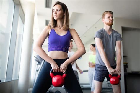 Group Of Young Friends Doing Exercises In Gym Stock Image Image Of