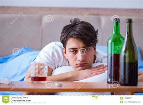 The Man Alcoholic Drinking In Bed Going Through Break Up Depression