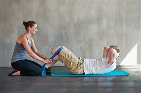 Man Woman And Physiotherapy With Prosthetic Amputee And Leg At Rehabilitation Exercise And