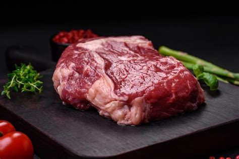 Premium Photo Fresh Raw Beef Steak With Salt Spices And Herbs