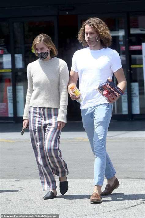 Emma Watson heads out with rumoured fiancé Leo Robinton after mounting speculation she is ...