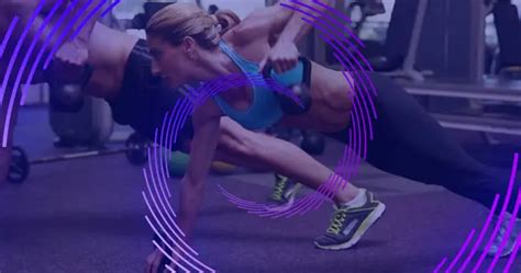 Fitness Enthusiasts Perform A Partner Workout At The Gym Their