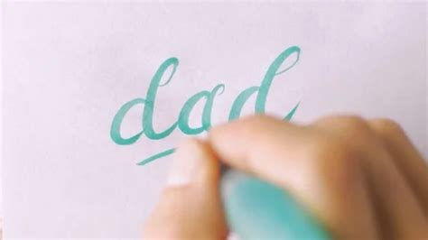 Hand writing the word DAD in cursive on ... | Stock Video | Pond5