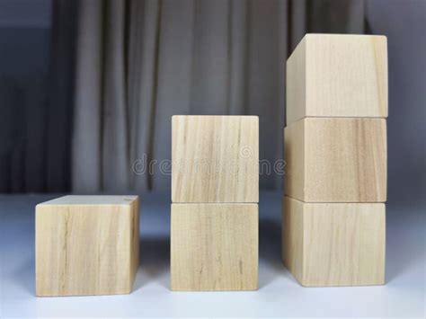 Small Wooden Cubes In Columns Lined Up In Row The Concept Of