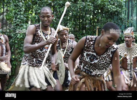 A Group Of Zulu Warriors In Traditional Clothing During The Dance