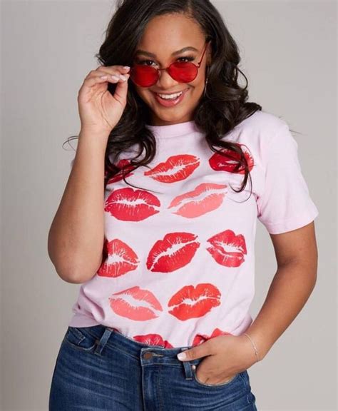 A Woman With Red Lipstick On Her Shirt