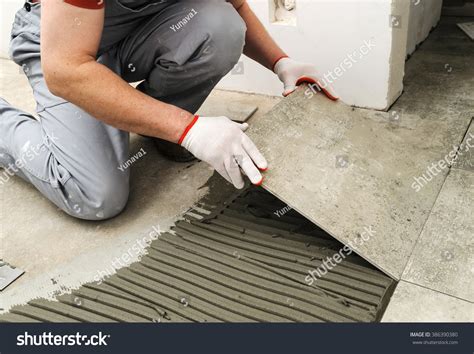 Laying Ceramic Tiles Worker Placing Ceramic Stock Photo