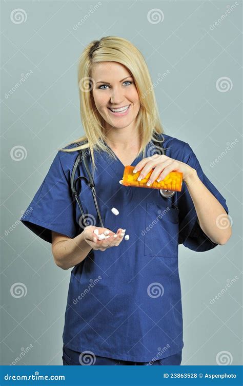 Beautiful Blonde Woman In Blue Scrubs Pills Stock Photo Image Of