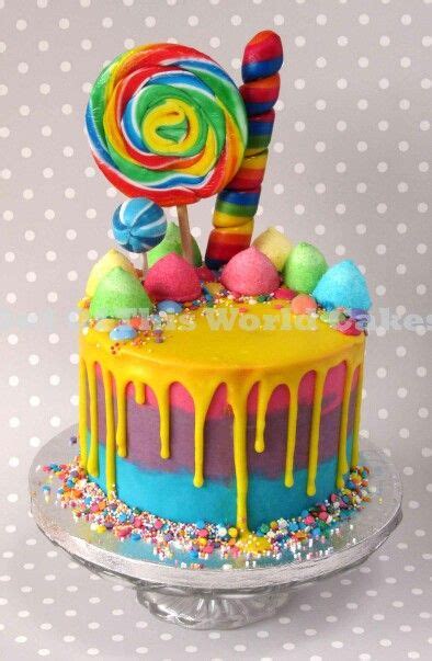 Drip Cake With Bright Rainbow Colours And Lots Of Sweets By Out Of This