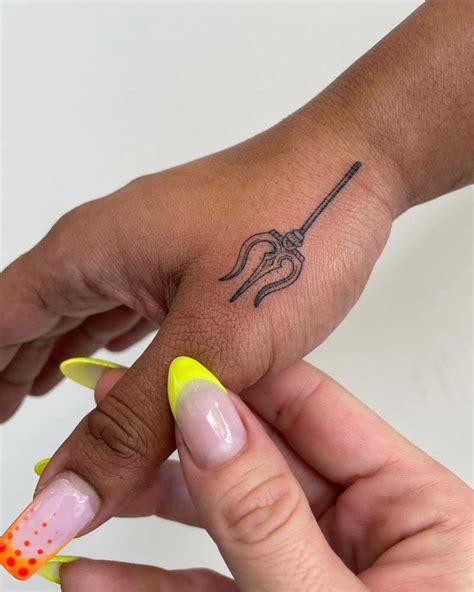 Trident Tattoo Located On The Hand