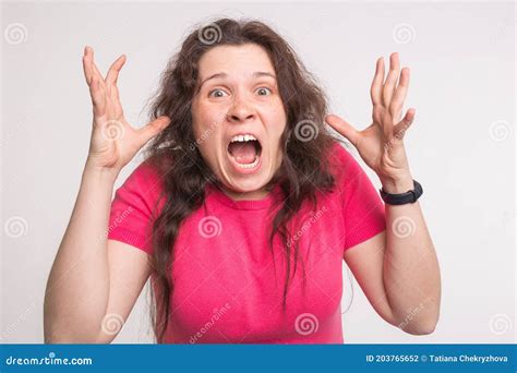 Portrait Of A Frustrated Angry Screaming Woman Screaming Out Loud On