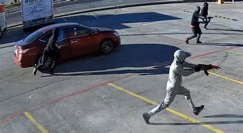 Dallas police hunt gunmen who unleashed hail of bullets in shopping ...