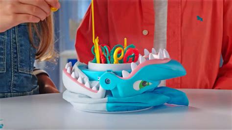 Have Fun While Teaching Fine Motor Skills With This Shark Bite Game