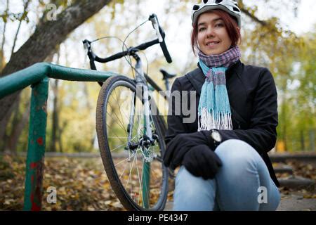 Sexy Brunette Biker Girl Sits On A Motorcycle Stock Photo Alamy