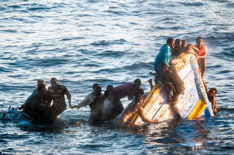 Mediterranean Migrants Off Libyan Coast Cling Onto Sinking Ship For