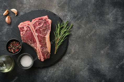 Premium Photo Tbone Or Porterhouse Raw Steak Of Beef Cut From The