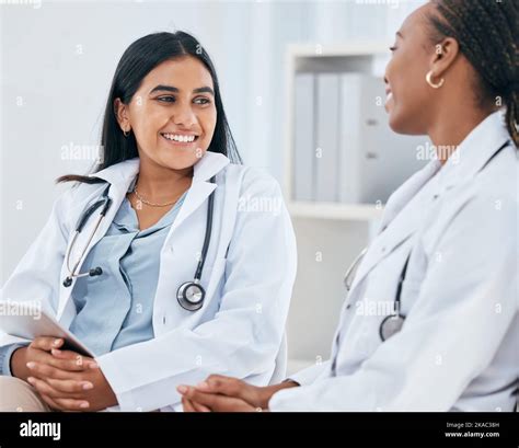 Diversity Healthcare And Doctors Talking In Hospital Having Casual