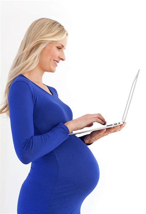 Pregnant Woman Using A Laptop Photograph By Ian Hooton Science Photo