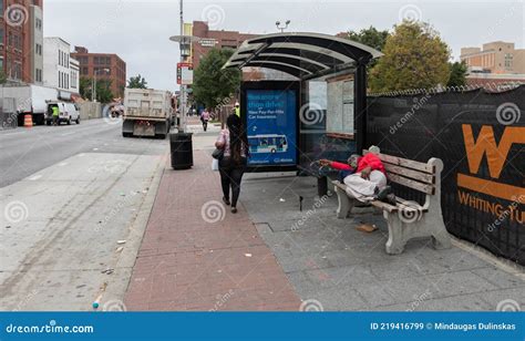 A Man Is Sleeping At A Bus Stop Editorial Image CartoonDealer