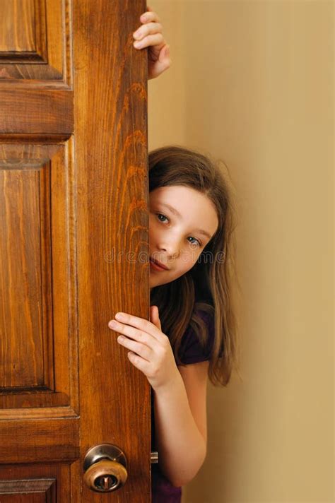 Girl Peeking Out The Door Stock Image Image Of Door 139619825