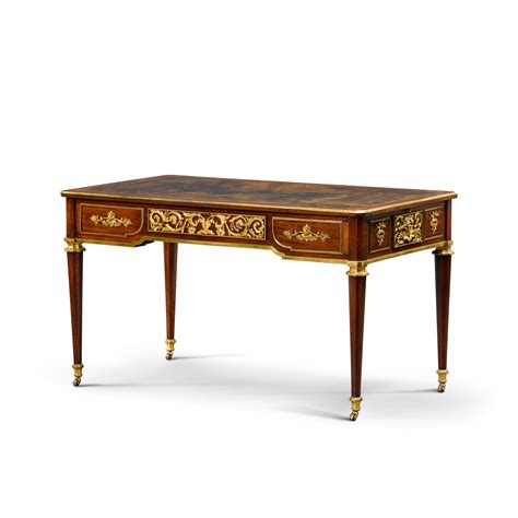 A Louis Xvi Style Gilt Bronze Mounted Mahogany Bureau Plat In The