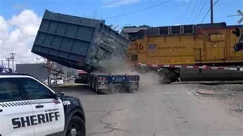 Watch Train Hit A Truck Toss 50 000 LBS Of Cargo Like A Feather