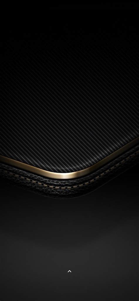 The Back End Of A Black And Gold Cell Phone