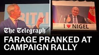 Watch Nigel Farage Speech Interrupted By Huge Banner Of Vladimir Putin