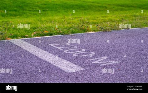 Jogging Track In The Park At Summer Day 2000 Meters Distance Sign