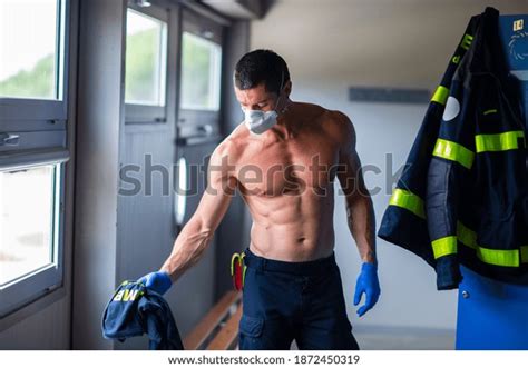 Serious Fireman Naked Torso Latex Gloves Stock Photo 1872450319