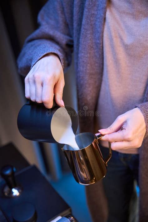 Woman Barista Pouring Milk From Pitcher Preparing Coffee In Coffee Shop