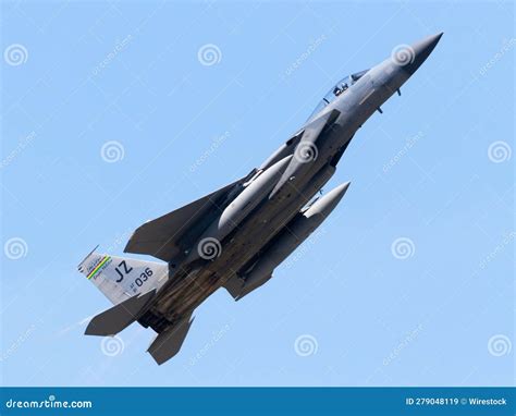 Fighter Jet Soaring Through A Bright Blue Sky Editorial Stock Image