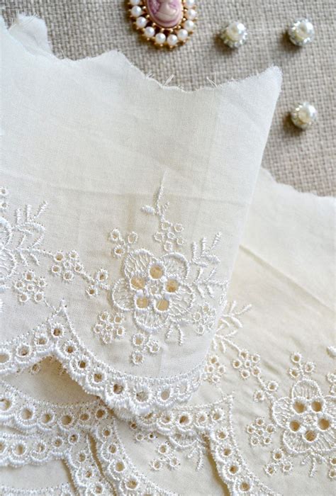 Several Pieces Of White Fabric With Beading On Them