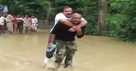 Bjp Mla Takes Piggyback Ride To A Boat During Assam Floods