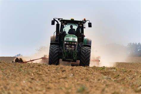 A Farmer Working on the Field with a John Deere Tractor Editorial Stock Image - Image of ...